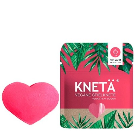 Bolsa ziplock de plastilina vegana artesanal de color rosa de la marca KNETÄ junto a una muestra de plastilina.